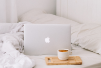 Wallpaper MacBook Beside Teacup with Latte