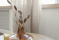 Wallpaper A Table with a Vase and Candle