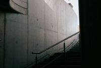 Wallpaper Black Metal Staircase on White Concrete Wall