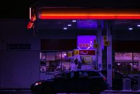 Wallpaper Black Car Parked in Front of Store