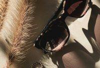 Wallpaper Black Framed Sunglasses on White and Black Textile