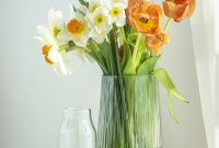 Wallpaper Orange and Yellow Flowers in Clear Glass Vase