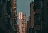 Wallpaper People Walking on Street Between High Rise Buildings