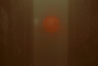 Wallpaper A Person Walking Through a Foggy Hallway