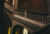 Wallpaper A Staircase in a Building with Stained Glass Windows