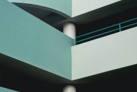 Wallpaper A Tall Building with Top Balconies
