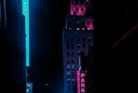 Wallpaper A City Street at Night with Neon Signs