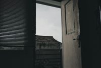 Wallpaper An Open Door Leading to a Dark Room