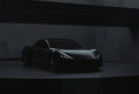 Wallpaper A Black Sports Car in a Dark Room