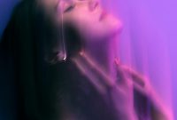 Wallpaper A Woman with Eyes Closed, Purple Background