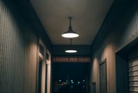 Wallpaper A Dark Hallway with a Hanging Light