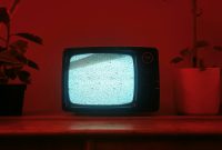 Wallpaper A Small Television on a Wooden Dresser