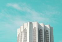 Wallpaper A Tall White Building Against a Sky