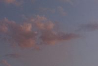 Wallpaper A Plane Flying Through Cloudy Skies