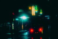 Wallpaper A City Street at Night with Traffic Lights
