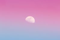 Wallpaper A Pink and Blue Sky with the Moon in the Distance