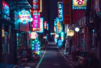 Wallpaper A City Street Filled with Lots of Neon Signs