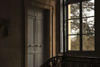 Wallpaper A Balcony with a Light Hanging from its Side