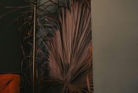Wallpaper A Lamp Next to a Plant